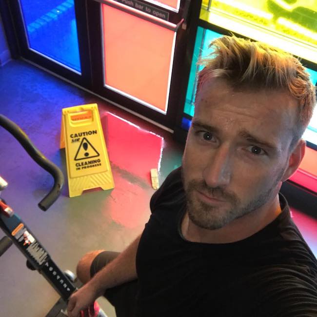 Jai McDowall doing spinning workout at TA Fitness in August 2018