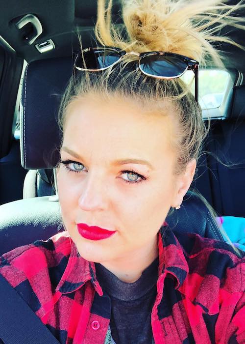 Kirsten Storms wearing red lipstick in a car selfie in February 2018