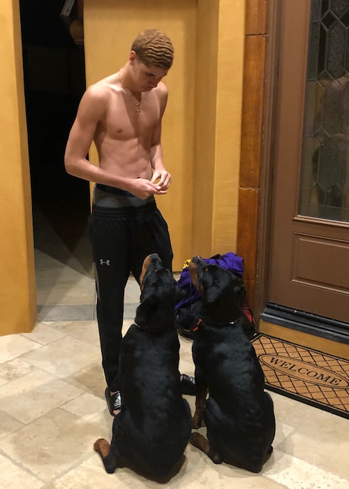 LaMelo Ball shirtless with his 2 dogs in May 2018