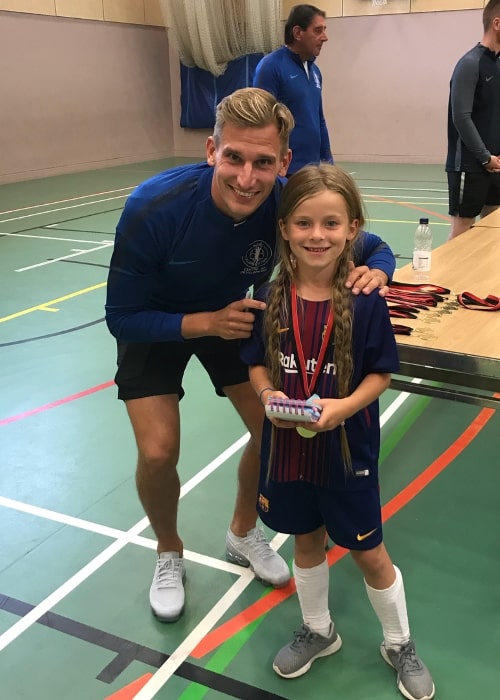 Marc Albrighton signing an autograph for a young fan