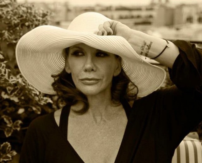 Melissa Gilbert in a picture wearing a white hat in Paris