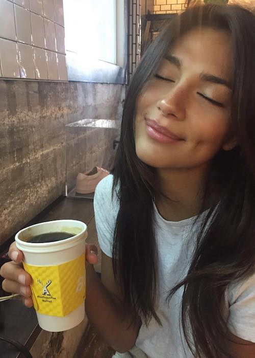 Pia Miller with her coffee cup at Alfred Coffee Melrose Place in June 2018