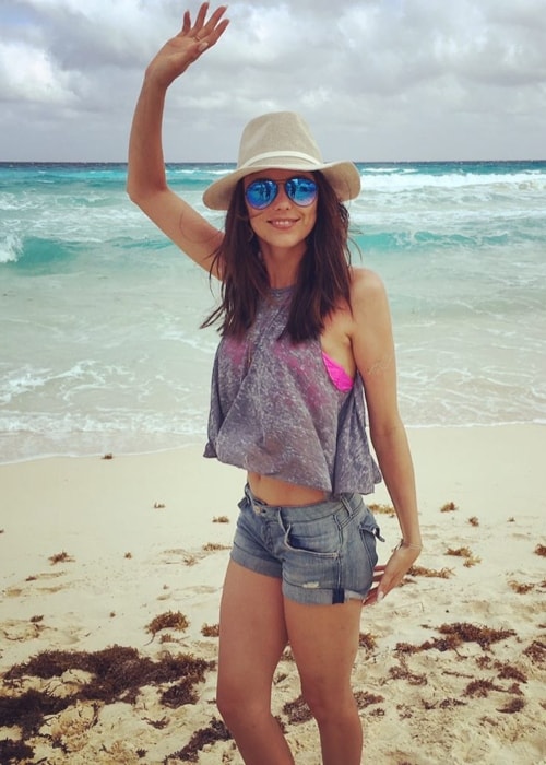 Riley Voelkel posing at a beach in May 2017