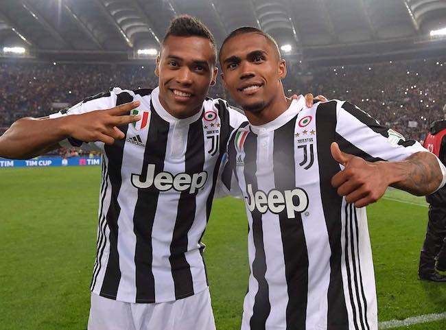 Alex Sandro (Left) with Douglas Costa as seen in September 2018