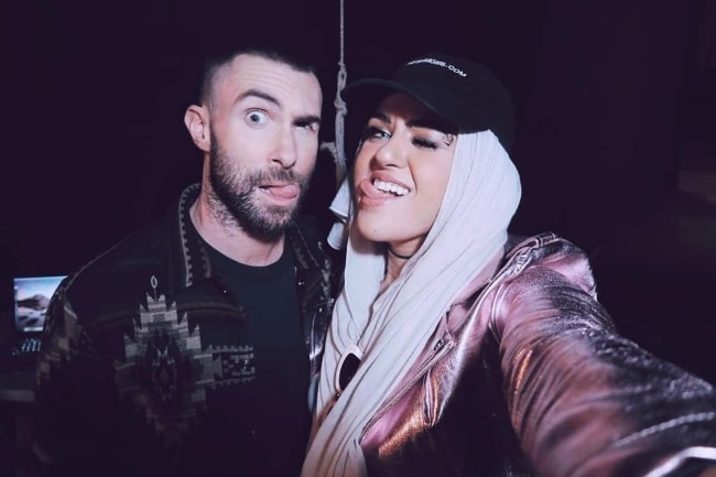 Amani Al-Khatahtbeh with Adam Levine in October 2018