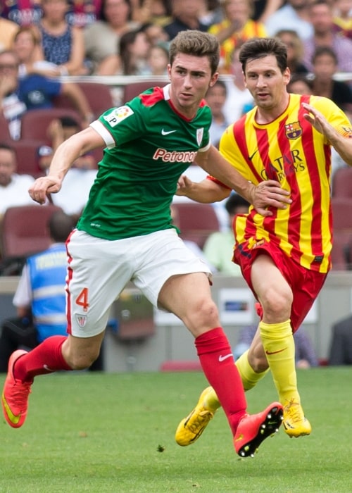 Aymeric Laporte (Left) with Lionel Messi during a La Liga match between FC Barcelona and Athletic Bilbao in September 2014