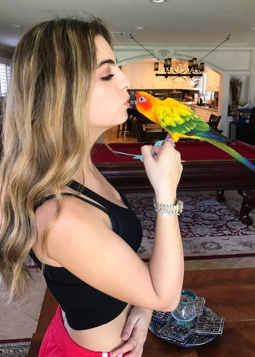 Dani Zvulun with her parrot as seen in August 2018