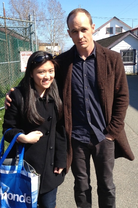 Ethan Embry posing with a fan in June 2015