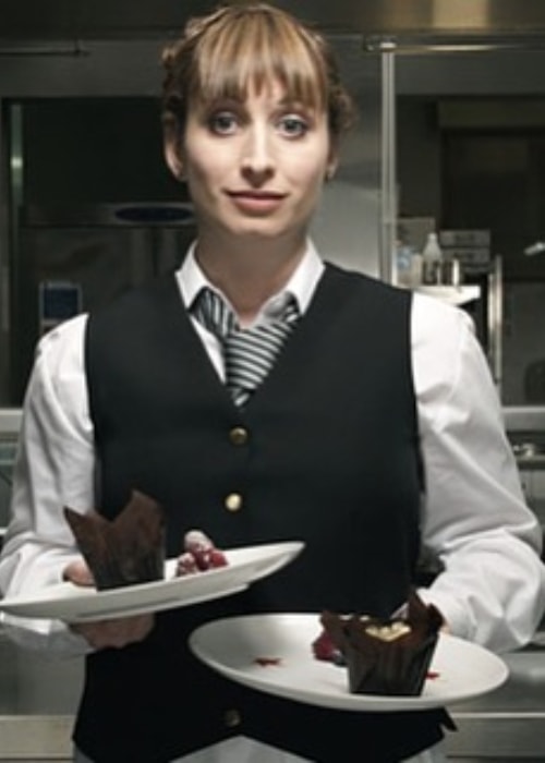 Isy Suttie with her plates of desserts in July 2018