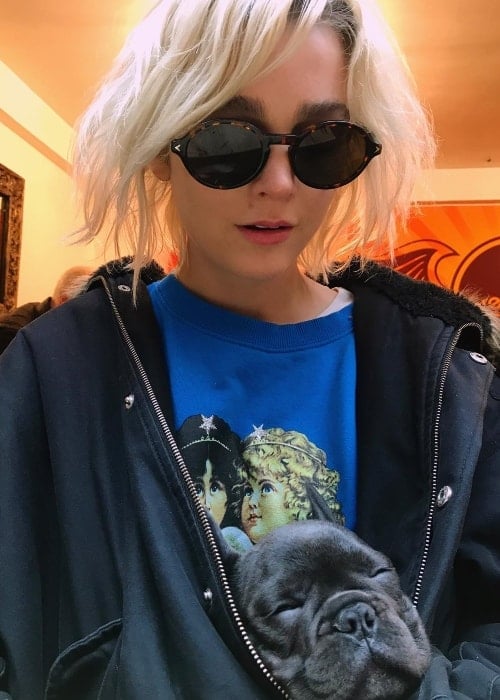 Allie Teilz with a dog resting in her jacket in January 2018