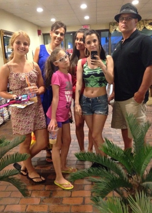 Alyssa Shouse taking a selfie with her family in July 2014