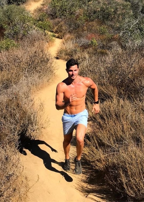 Drew Harrisberg running shirtless at Temescal Canyon in November 2018