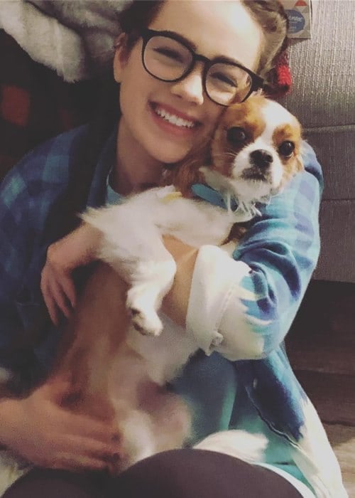 Mary Mouser with her dog as seen in May 2018