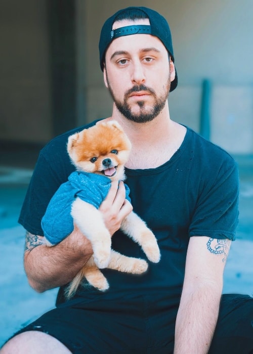 Jon Paul Piques posing with a dog in August 2017