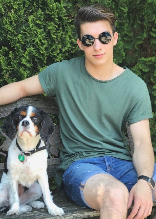 Josh Bogert posing with the puppy, Lucy, in May 2017