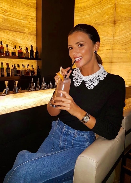 Lucy Mecklenburgh enjoying her drink at Armani Hotel Milano in December 2018