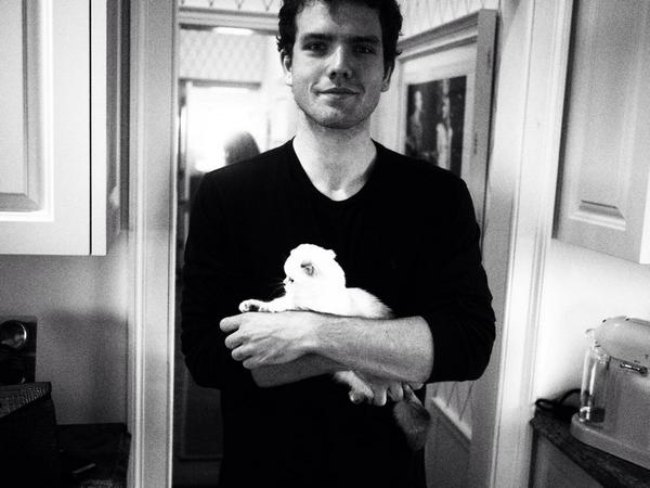 Austin Swift with his cat as seen in August 2014