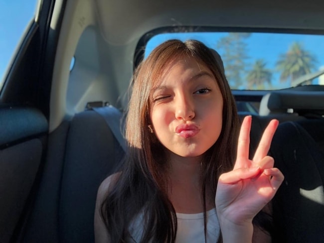 Elle Paris Legaspi posing inside a car in October 2018