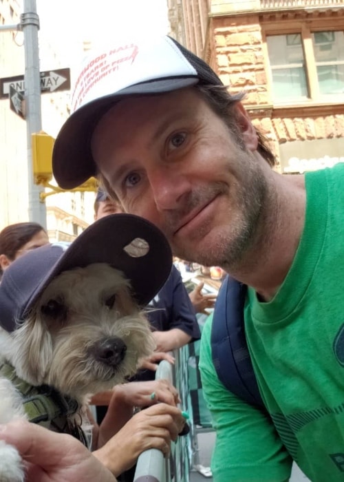 Josh Hamilton posing with a puppy