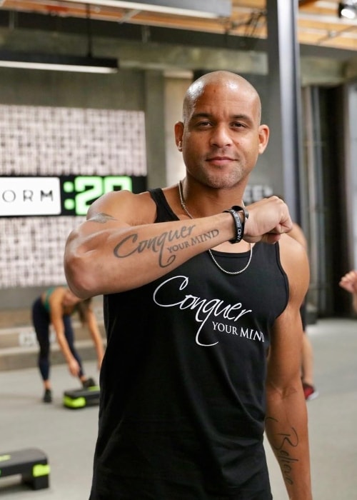 Shaun T 2024: Husband, net worth, tattoos, smoking & body facts - Taddlr