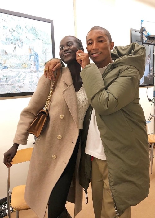 Adut Akech with Pharrell Williams in Decemeber 2018