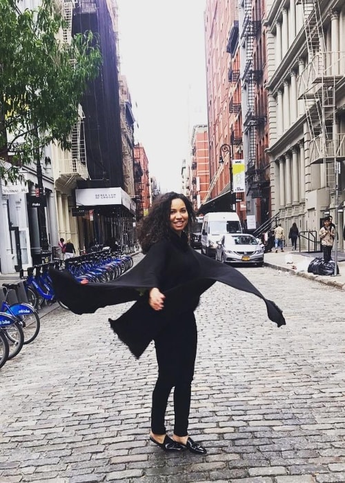 Jurnee Smollett-Bell posing happily in the middle of the street