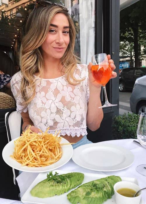 Mary Miller eating french fries at a restaurant in August 2018