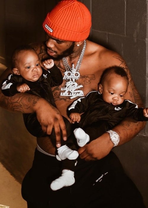 Q Da Fool pictured with his twin sons in September 2018
