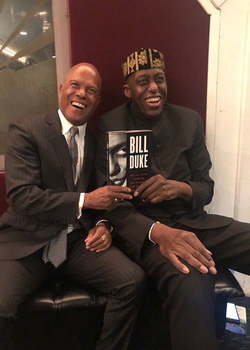 Bill Duke with Michael Beck Sharing his Autobiography with Him as seen on his Twitter Profile in February 2019