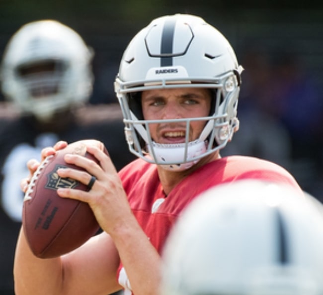 Derek Carr as seen while throwing a pass during The Raiders' practice session at their training facility in the Napa Valley, California in August 2018