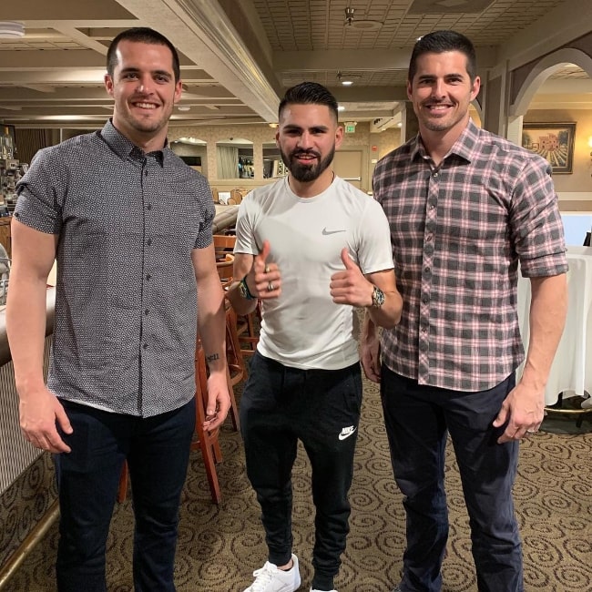 Derek Carr as seen with former football quarterback, David Carr (Right), and professional boxer, José Ramírez (Center), in March 2019