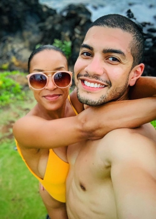 Rick Gonzalez posing shirtless while taking a selfie with his wife in Wailea-Makena, Hawaii