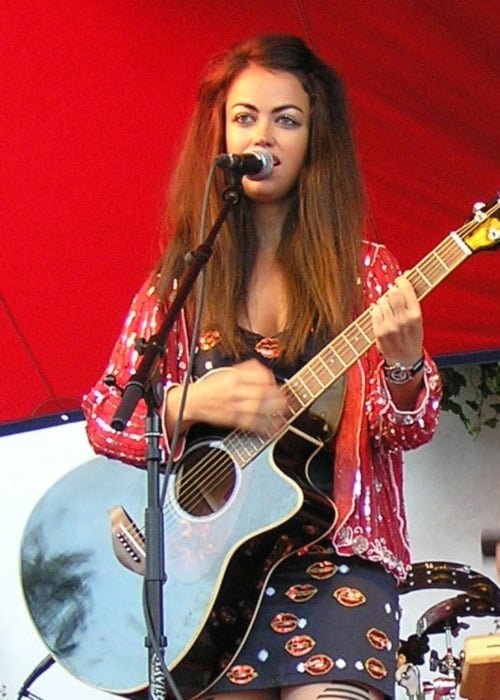 Aura Dione as seen in a picture taken during her performance alongside her band at Gæstgiveren, Allinge, Bornholm, Denmark, in January 2012