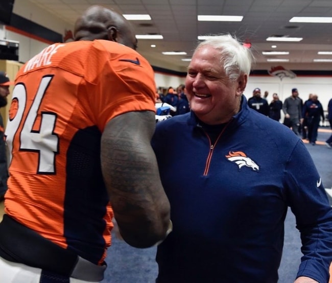 DeMarcus Ware (Left) as seen while sharing a moment with his coach