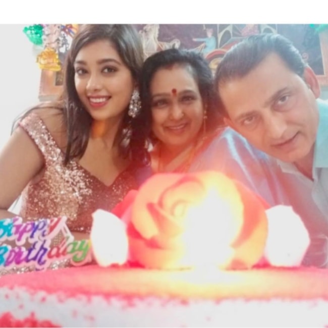 Digangana Suryavanshi as seen in a picture celebrating her mothers birthday alongside her father in February 2019