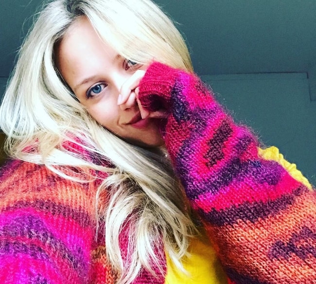 Gracie Dzienny as seen while taking a selfie wearing a cute sweater in September 2018