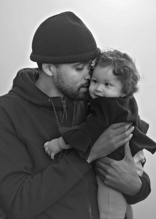 JRDN in a black-and-white picture with his daughter