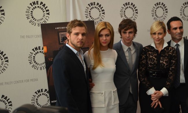 Max Thieriot alongside his castmates from Bates Motel