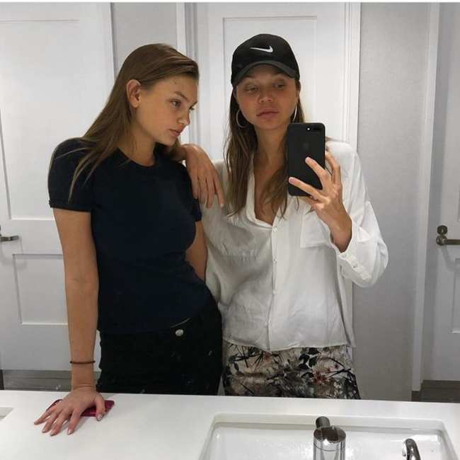 Olivia Brower with model Jessie Andrews in a bathroom selfie taken in February 2018