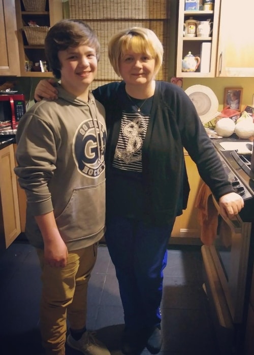 Owen Asztalos as seen in a picture with his grandmother while standing in the kitchen in March 2019