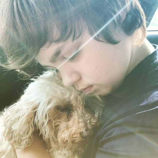 Owen Asztalos as seen in a picture with his puppy named Lucy