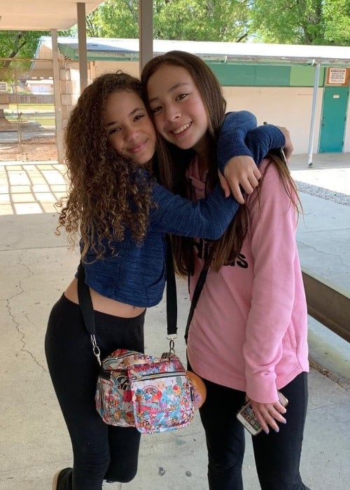 Scarlet Spencer (Left) as seen while posing with close friend and actress, Aubrey Anderson-Emmons, in March 2019