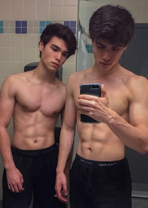 Alan Stokes (Left) as seen while posing for a shirtless mirror selfie with his younger twin brother, Alex Stokes, in September 2018