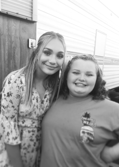 Alana Thompson as seen in a black-and-white picture while posing with actress, dancer, and model, Maddie Ziegler