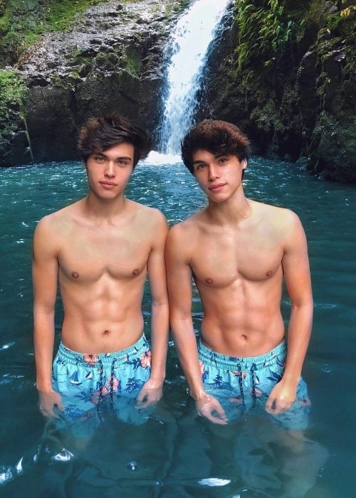 Alex Stokes as seen while posing shirtless with his twin brother, Alan Stokes (Right), in Maunawili, Oahu, Hawaii, United States in December 2017