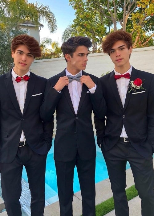 Alex Stokes as seen while posing with his friend, Brent Rivera (Center), and his older twin, Alan Stokes (Right), in September 2018