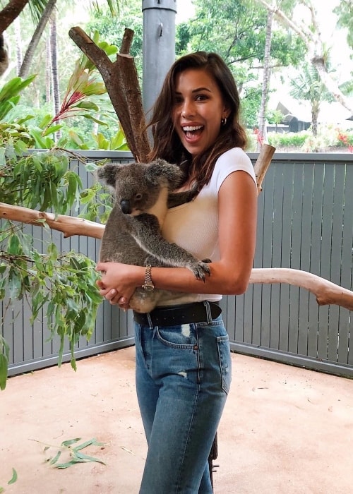 Devin Brugman as seen while posing for a picture while cuddling a koala at the Koolah Cafe in February 2019