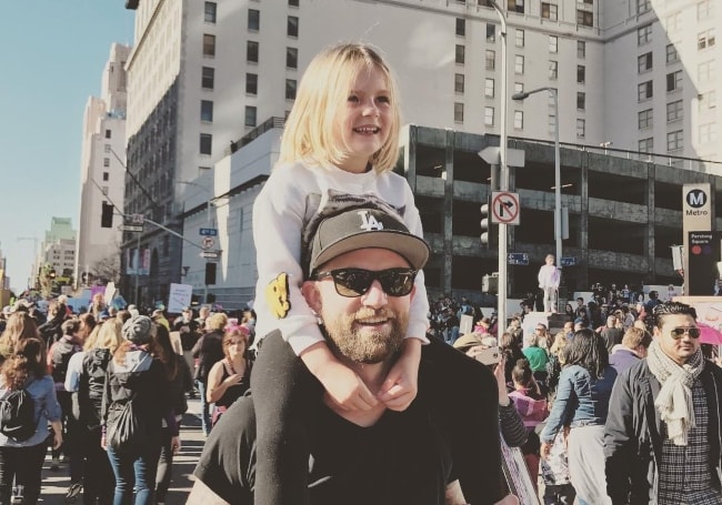 Joel Little as seen while carrying his daughter on his shoulders during the Women's March in January 2017