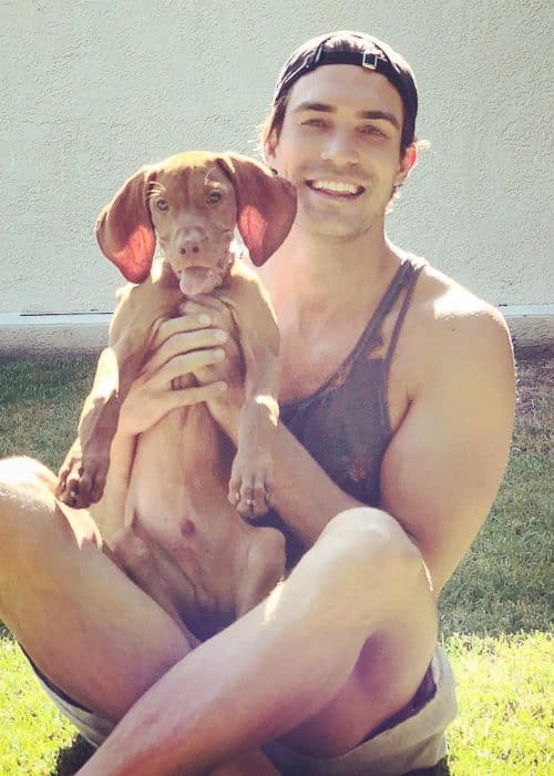 Peter Porte with his dog as seen in July 2018