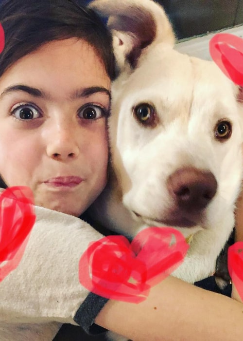 Abby Ryder Fortson as seen in a picture with her pet dog Thomas in February 2019